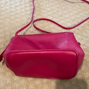 Pink leather cross body purse.